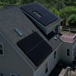 House with solar panels for solar tax credits blog